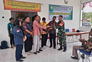 Babinsa Koramil 1710-03/Kuala Kencana Hadiri Musrenbang Kampung Karya Kencana
