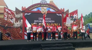 Babinsa Sukaasih Amankan Kirab Merah Putih Jelang HUT RI ke-81